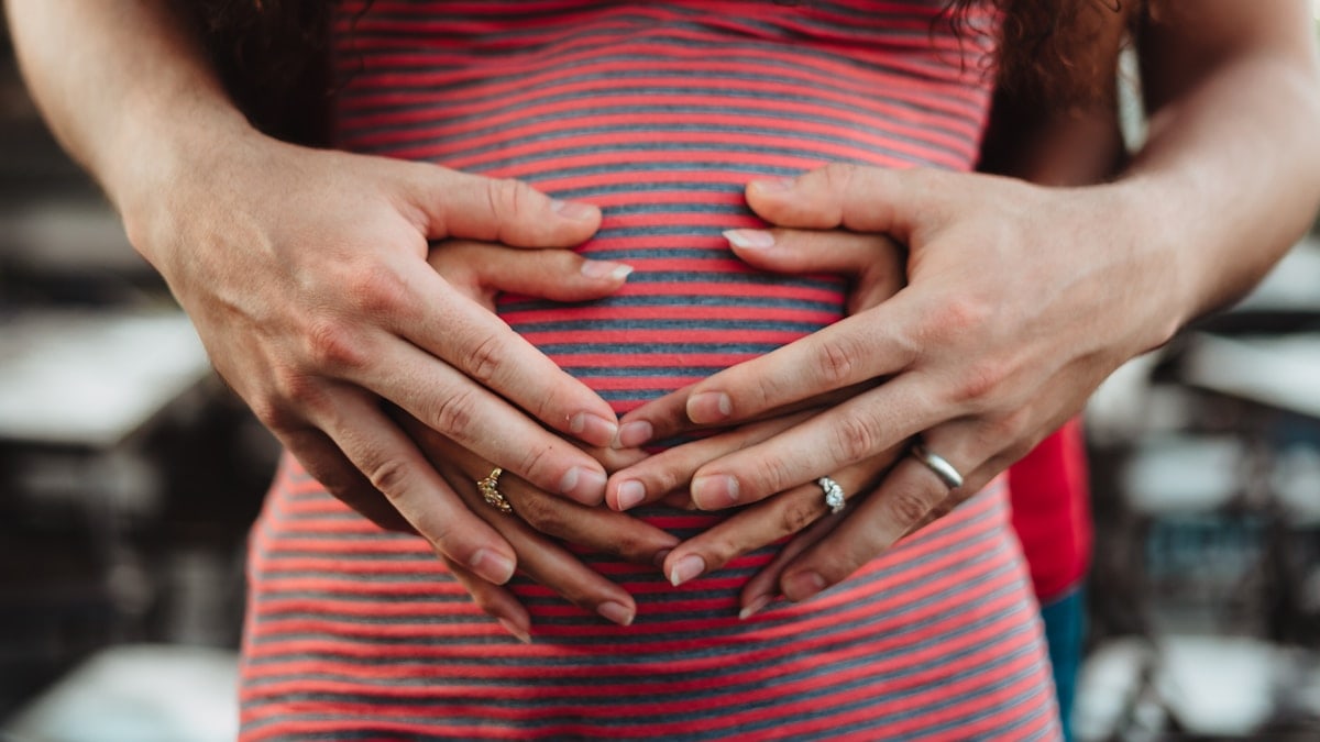 preganant woman holding tummy